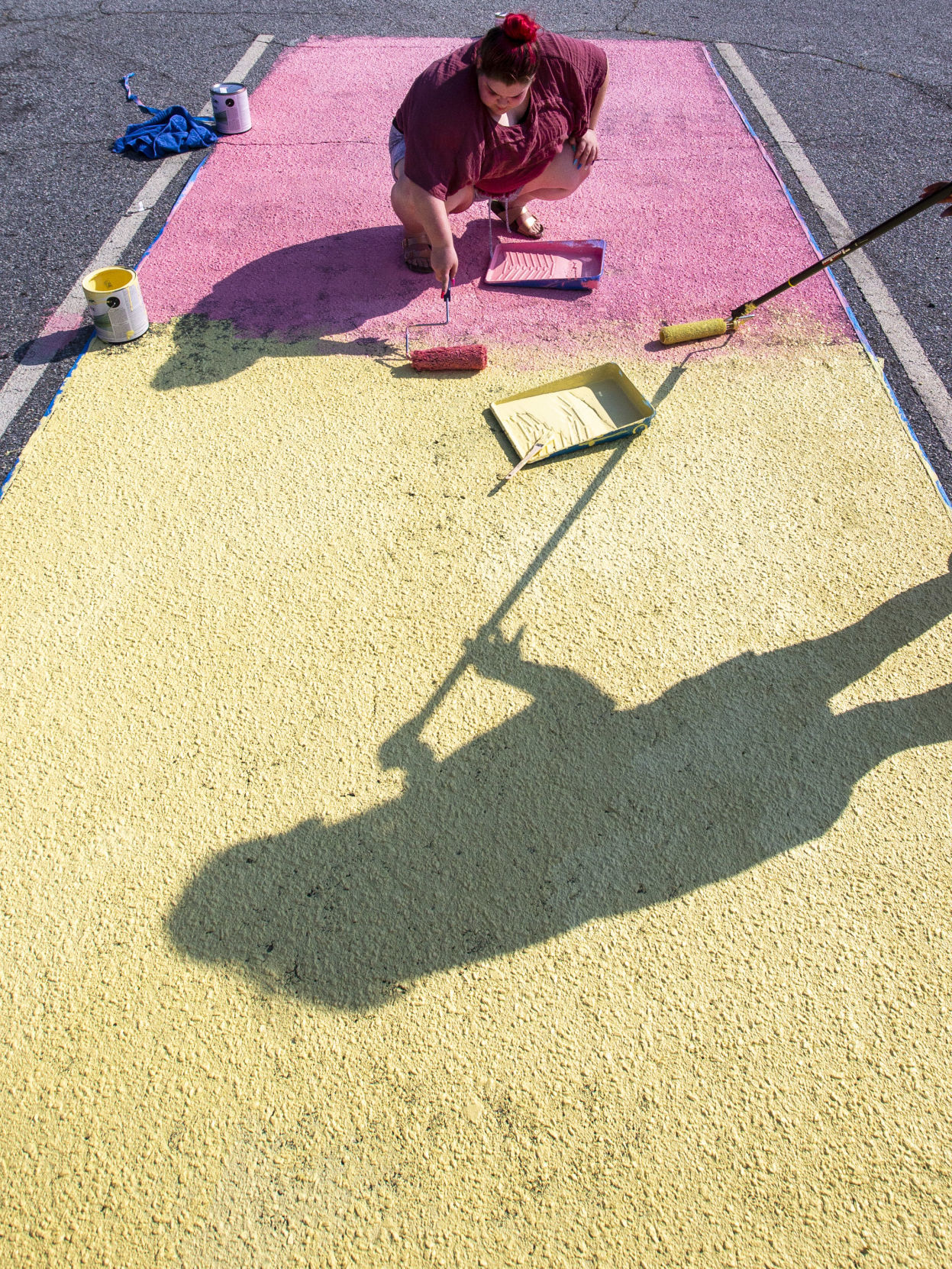 Students painting their parking spaces